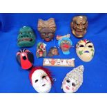 A COLLECTION OF DECORATIVE MASKS