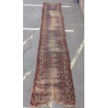 AN ANTIQUE NORTH-WEST PERSIAN RUNNER (EXAMINE)