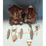 TWO CUCKOO CLOCKS, ONE OF TYPICAL 'BLACK FOREST' TYPE