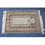 A CREAM GROUND PRAYER RUG