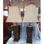 A PAIR OF ARCHAISTIC CAST METAL LAMPS