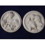 A PAIR OF CLASSICAL STYLE RESIN ROUNDELS