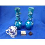 A PAIR OF TURQUOISE GLAZED VASES ENTWINED WITH DRAGONS