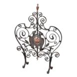 AN ARTS AND CRAFTS STYLE WROUGHT-IRON FIRESCREEN