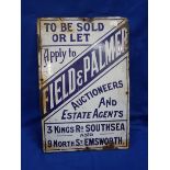 AN ENAMELLED SIGN: 'FIELD & PALMER, AUCTIONEERS AND ESTATE AGENTS'