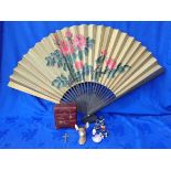 A SMALL LAQUERED TABLE CABINET, A LARGE JAPANESE FAN