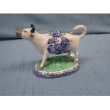 A 19TH CENTURY STAFFORDSHIRE COW CREAMER