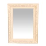 A CREAM PAINTED WALL MIRROR