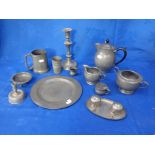 A HAMMERED PEWTER TEA SET