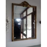 A GILT BRASS FRAMED MIRROR