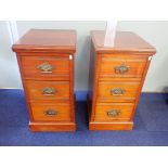 A PAIR OF WALNUT BEDSIDE CHESTS