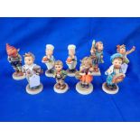 A COLLECTION OF GOEBEL HUMMEL FIGURES