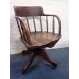 AN EARLY 20TH CENTURY ELM AND ASH OFFICE CHAIR