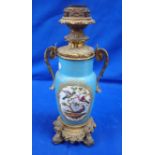 A 19TH CENTURY FRENCH CERAMIC AND ORMOLU OIL LAMP