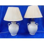 A PAIR OF WHITE GLAZED POTTERY TABLE LAMPS