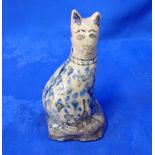 A NAIVELY POTTED PERSIAN POTTERY CAT