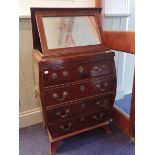 A GEORGE III STYLE MAHOGANY DRESSING CHEST, OF BOMBE FORM