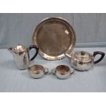 A LIBERTY 'TUDRIC' PLANISHED PEWTER TEA SET, NUMBERED 01535