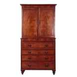 AN EARLY VICTORIAN MAHOGANY SECRETAIRE BOOKCASE