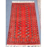 A RED GOUND KESHAN TYPE RUG