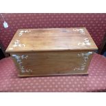 A SMALL TEAK TRUNK WITH MOTHER-OF-PEARL INLAY