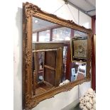 A 19TH CENTURY STYLE GILT FRAMED WALL MIRROR