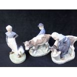 THREE COPENHAGEN PORCELAIN FIGURES - TWO CALVES WITH HANDLERS AND 'GOOSE GIRL'