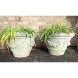 A PAIR OF RECONSTITUTED GARDEN PLANTERS