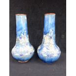 A PAIR OF ROYAL DOULTON VASES WITH RAISED-LINED FLORAL DECORATION