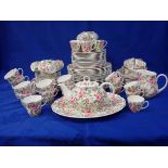 AN EXTENSIVE QUEEN'S CHINA 'COTTAGE ROSE' DINNER AND TEA SERVICE