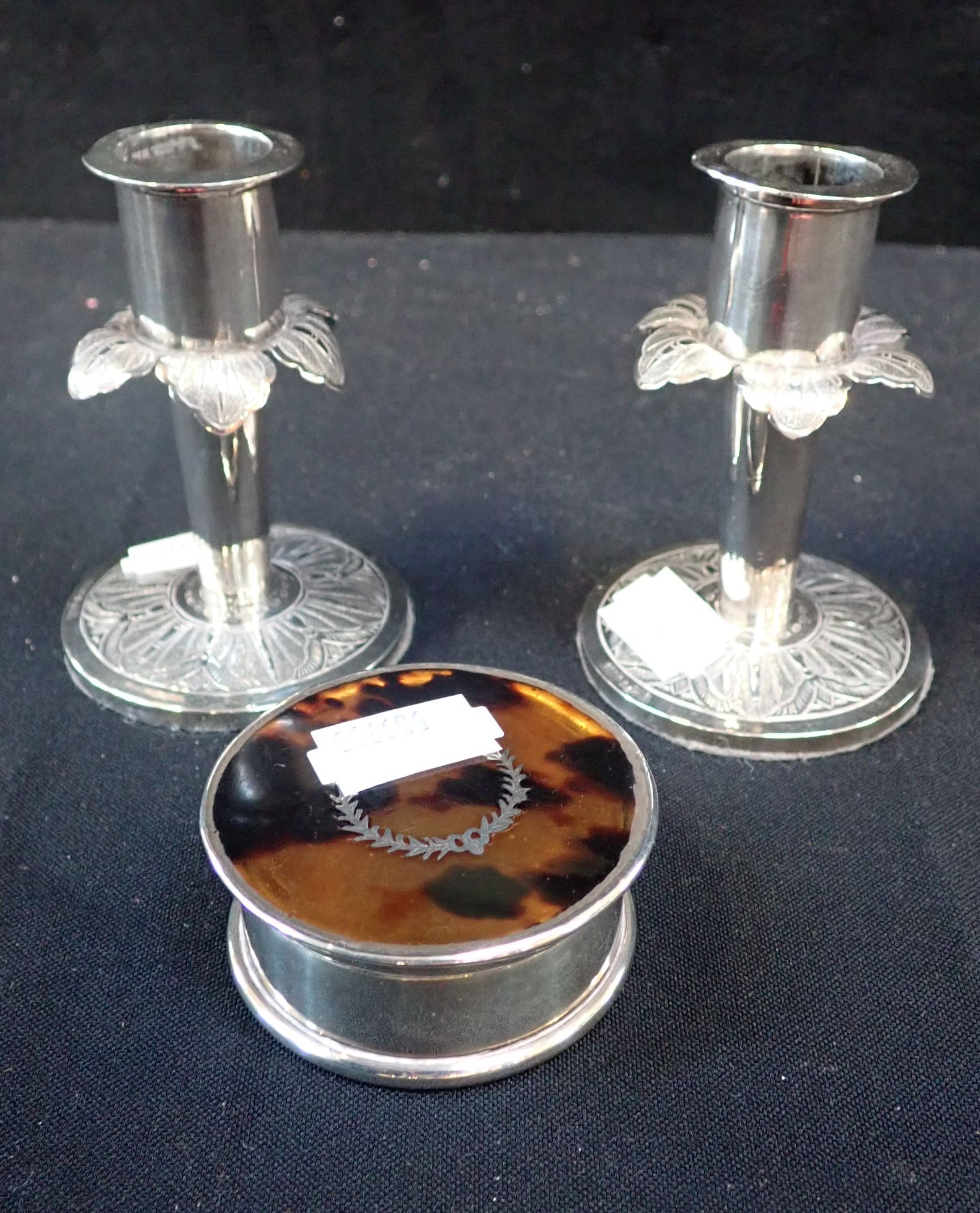 A PAIR OF WHITE METAL MINIATURE CANDLESTICK