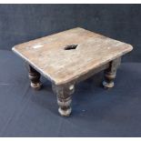 A SMALL OAK FOOTSTOOL