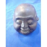 A FOUR-FACED PATINATED BRONZE BUDDHA