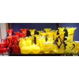 A COLLECTION OF YELLOW AND RED GLASS VASES