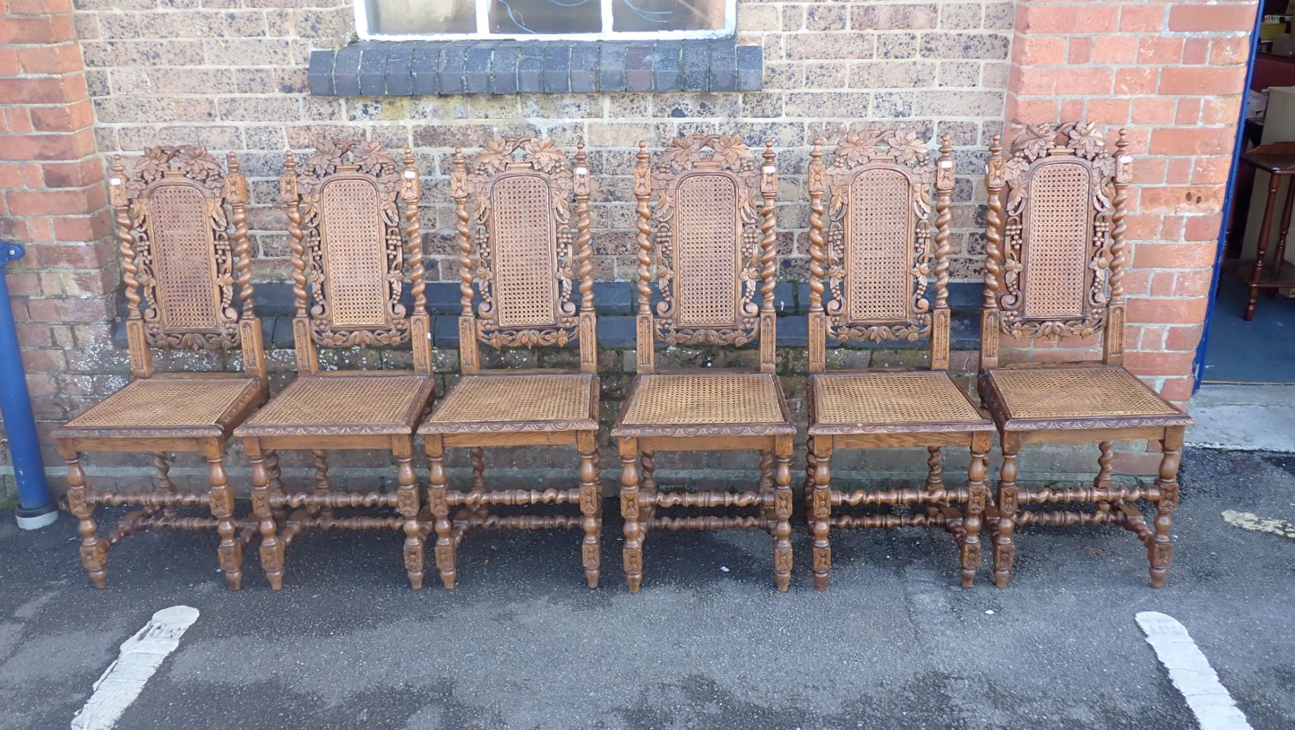 A SET OF SIX 19TH CENTURY FLEMISH STYLE CARVED OAK DINING CHAIRS