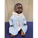 BLACK BABY COMPOSITION DOLL, BLUE WOOLLEN JACKET