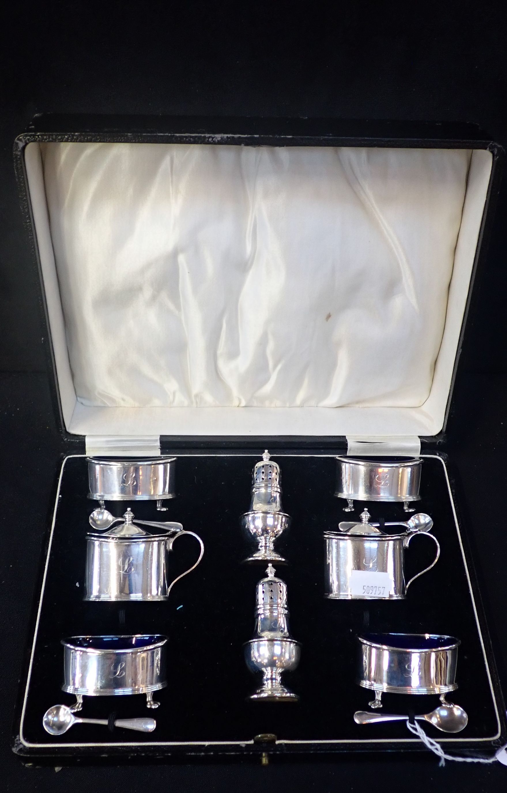 A GEORGE V SILVER EIGHT PIECE CRUET