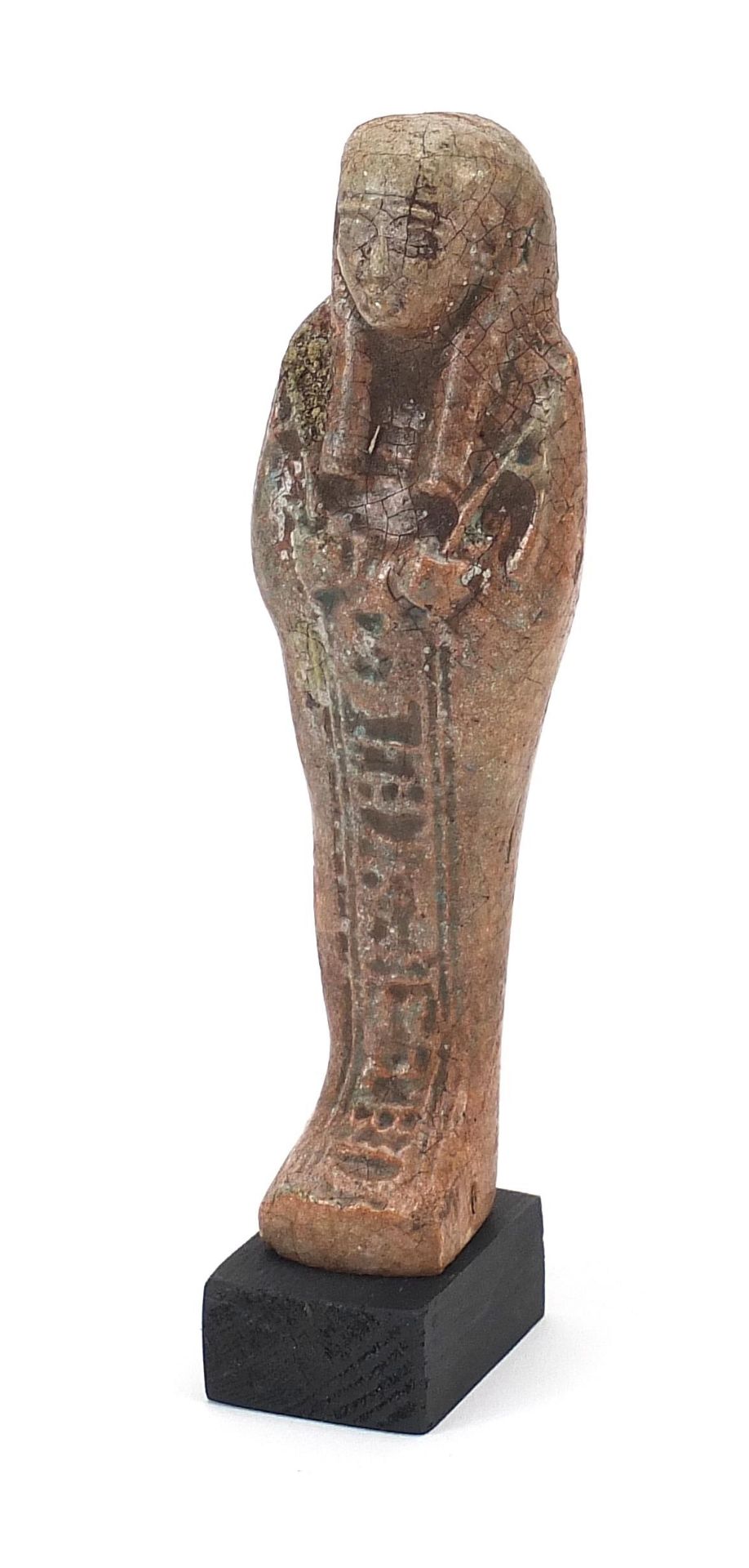 Egyptian style ushabti raised on a wooden base, overall 19cm high