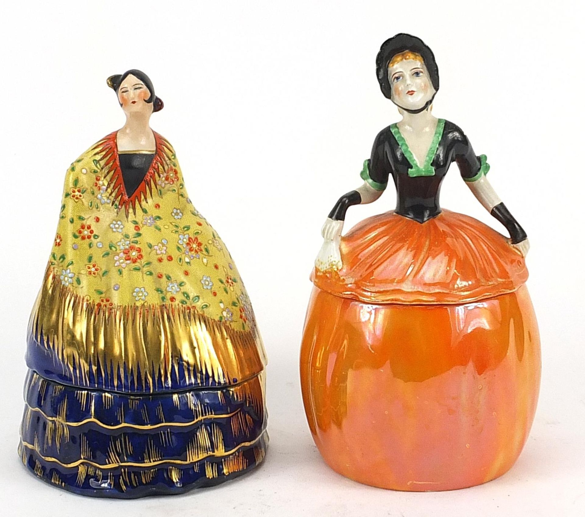 Two Carltonware Crinoline Lady powder pots with covers, the largest 20.5cm high Overall in generally