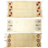 Three antique South Serbian ceremonial towels embroidered with flowers, the largest each 110cm x