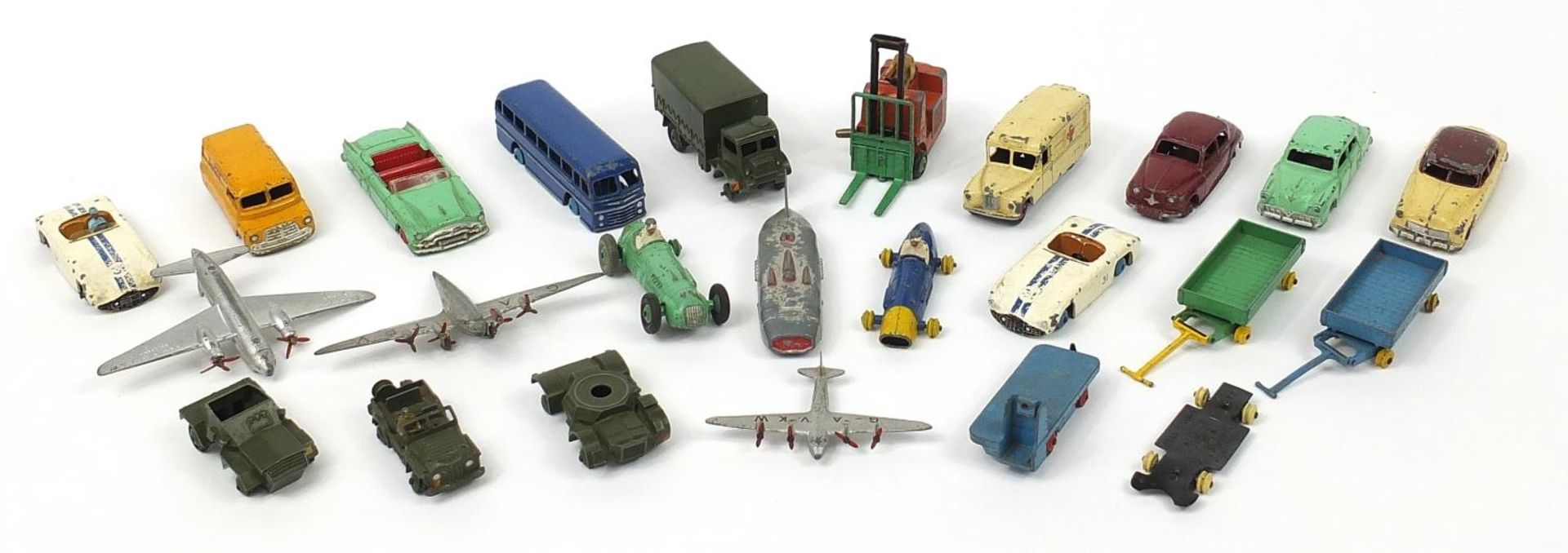 Collection of vintage Dinky diecast vehicles and aeroplanes including Red Cross van and racing cars