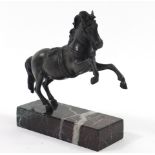 After Minati, patinated bronze rearing horse raised on a marble base, 24cm high Overall in generally