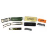 Six vintage and later harmonicas including Hohner, four with boxes