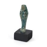 Egyptian style ushabti raised on a wooden base, overall 8cm high