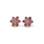 Pair of 9ct gold ruby and diamond flower head stud earrings, 8mm in diameter, 1.0g