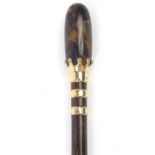 Bamboo walking stick with faux tortoiseshell pommel and gold plated mounts, 90cm in length