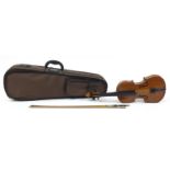 Wooden violin with bow and protective carry case, the violin bearing a paper label The Buckingham