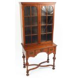 Mahogany bookcase on stand with three drawers, 160cm H x 76cm W x 41.5cm D