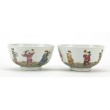 Pair of Chinese porcelain bowls hand painted in the famille rose palette with figures on waves,