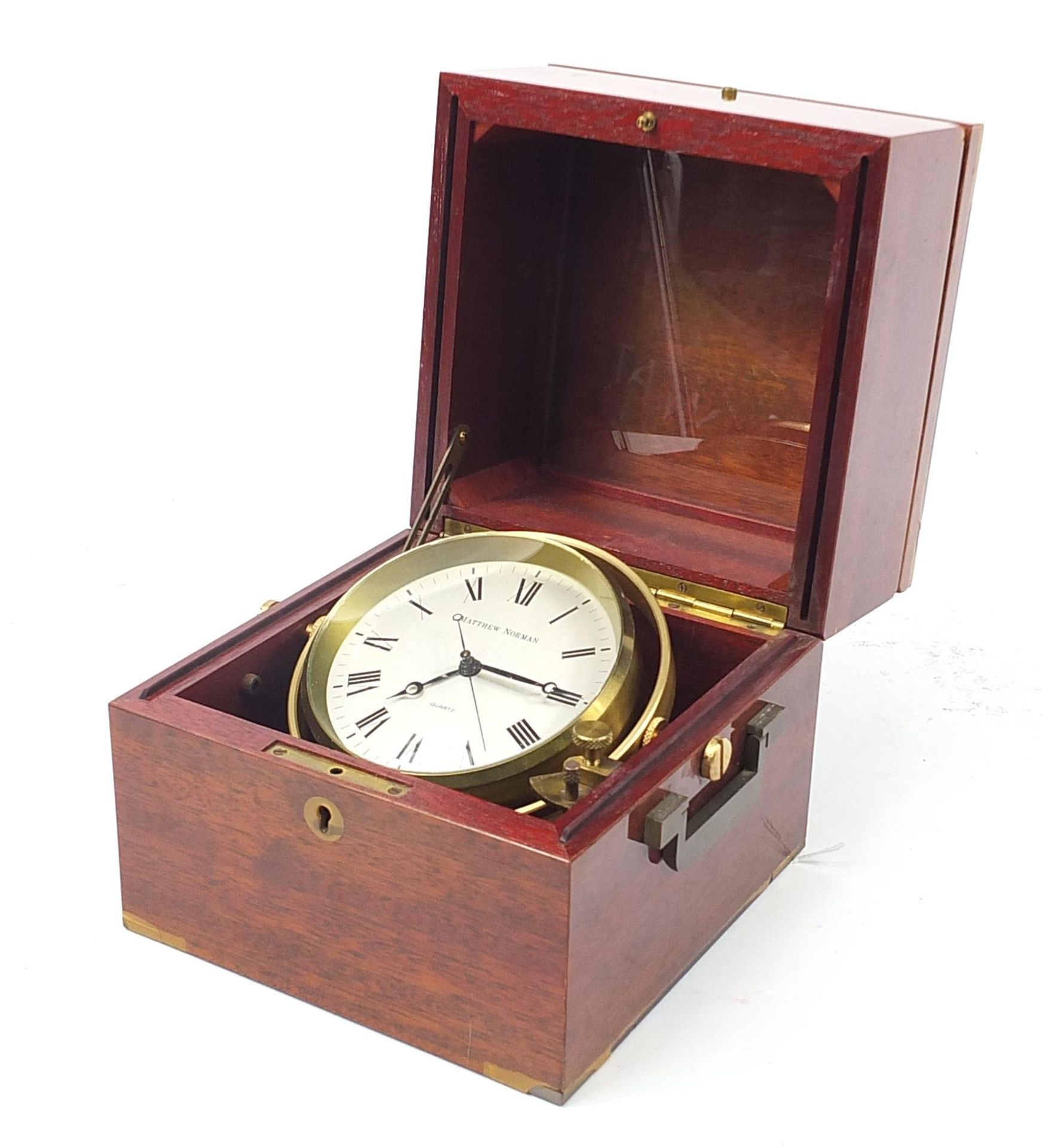 Matthew Norman ship's design clock housed in a mahogany case with brass mounts, 17.5cm x 17cm W x